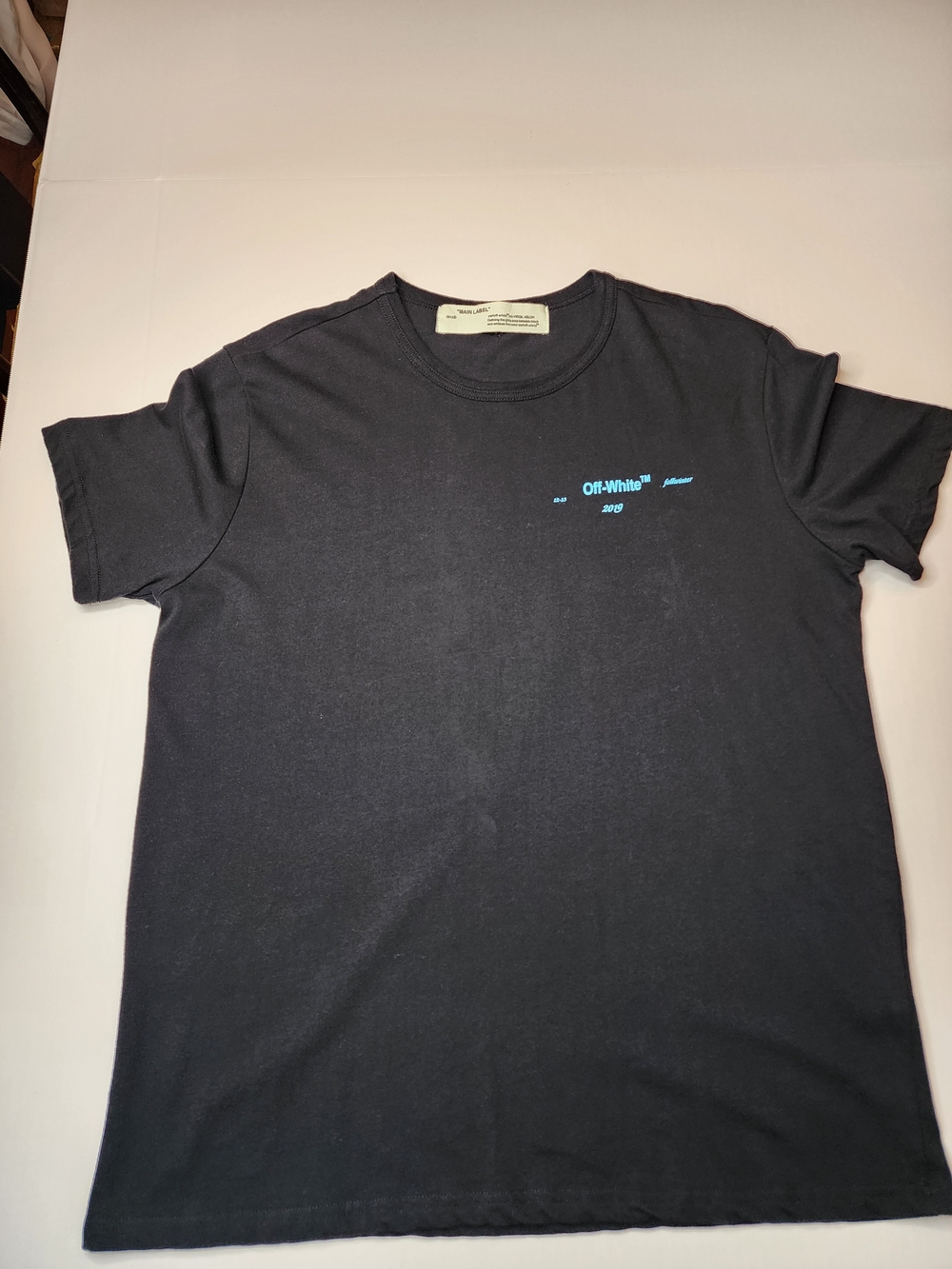 Off-White Black Short Sleeve Tee with Small Light Blue Chest Logo